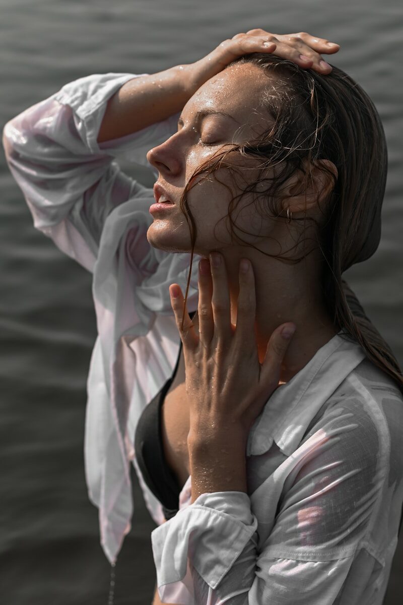 a person with the hands on the face